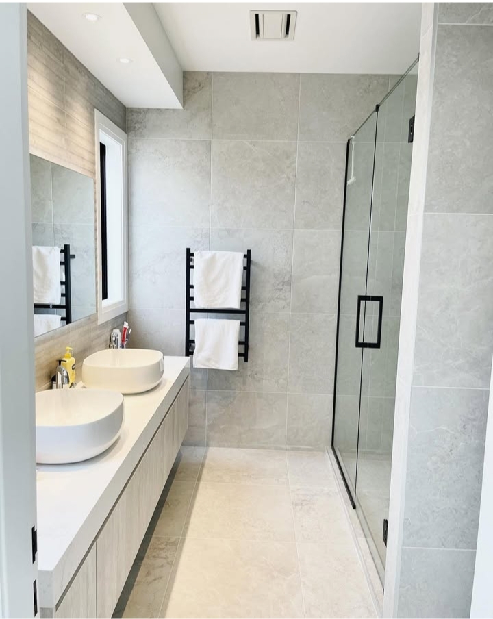 Precision-laid herringbone pattern tile flooring in a residential space